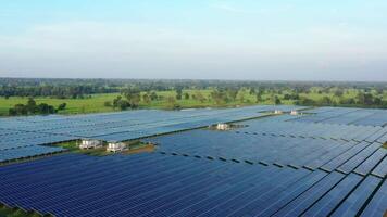 Aerial view from drone of solar panels stand in a row, green energy landscape electrical power ecology innovation nature environment video