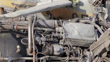 Detail of the Mi-24 helicopter. Remains of a destroyed Russian Air Force combat helicopter Hind Crocodile. Engine rotor, blades, tail, wreckage of a crashed military attack helicopter close-up.