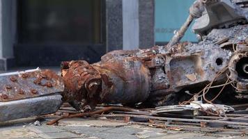 Detail of the Mi-24 helicopter. Remains of a destroyed Russian Air Force combat helicopter Hind Crocodile. Engine rotor, blades, tail, wreckage of a crashed military attack helicopter close-up. video