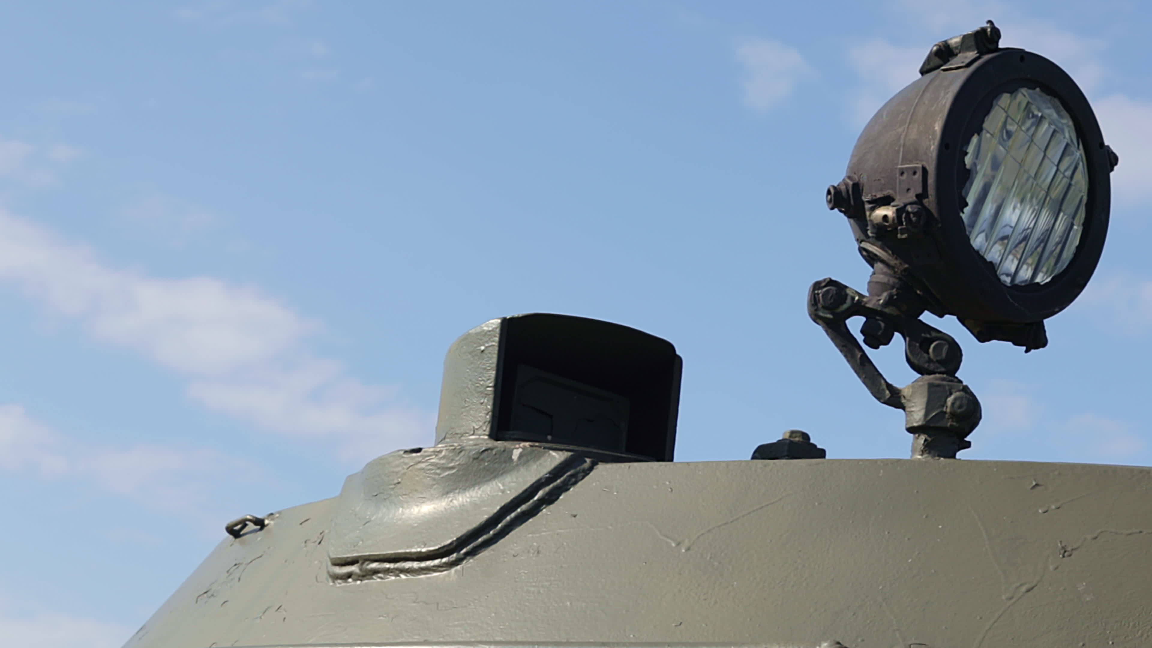 Front headlight of a Soviet battle tank. Very bright searchlight on the