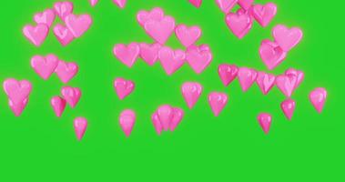 corações 3d rosa estão caindo e girando com tela verde video