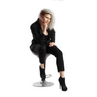 beautiful blonde business woman on chair photo