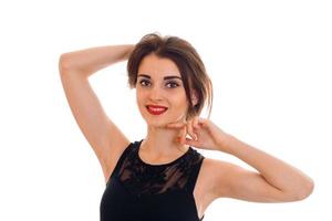 close up portrait of young woman with red lips posing and looking at the camera isolated on white background in studio photo