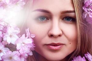 Close up beauty photo of young cutie girl with flowers