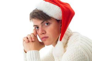 young guy in red senta hat photo