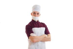 young doctor graduate student with hat on his head and a mask on the face photo