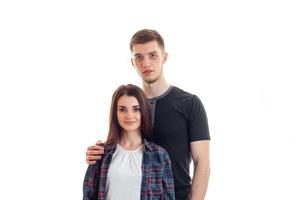 smiling beautiful girl standing next to a young high guy and looking at camera photo