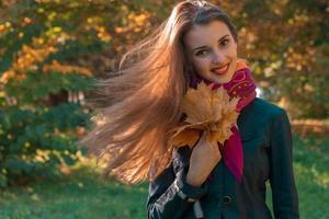 beautiful girl stands on the street and her hair fly through the Air Zoom photo