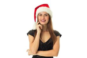 Cute happy girl in santa hat photo