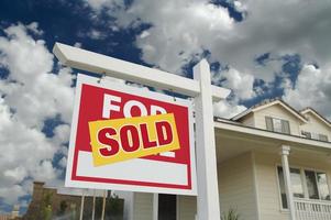 Sold Home For Sale Sign and New Home photo