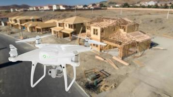 Unmanned Aircraft System UAV Quadcopter Drone In The Air Over Construction Site. photo