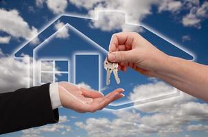 Handing Over Keys on Ghosted Home Icon, Clouds and Sky photo