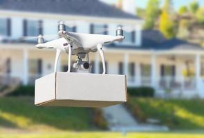 Unmanned Aircraft System Quadcopter Drone Delivering Package At House photo