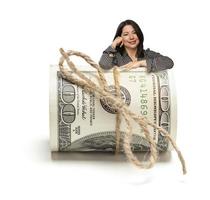 Hispanic Woman Leaning on a Roll Of Hundred Dollar Bills photo