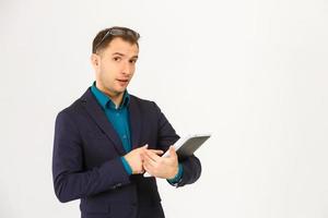 A view of a shocked young businessman isolated on white background photo