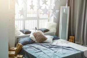 White and grey master bedroom with large windows and double bed photo