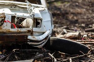 Vandalised car lies abandoned photo