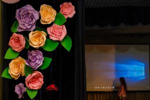 Decor with artificial flowers and curtains. Dark room lighting. photozone photo