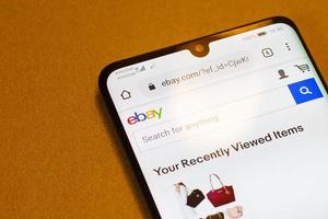 eBay, on the screen smartphone. Closeup mobile applications for shopping, e-commerce. Kyiv, Ukraine - November 11, 2019 photo