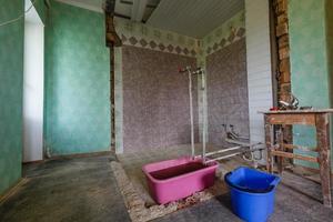 Devastated kitchen in a demolition house photo