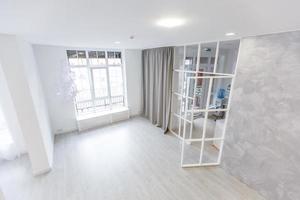 White empty room interior with wood floor, window, door. photo