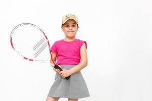 little girl with a tennis racket isolated on a over white photo