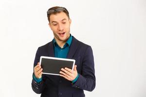 A view of a shocked young businessman isolated on white background photo