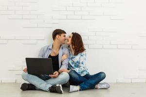 Nice portrait of couple with laptop. photo