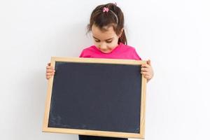 little girl holding a board photo