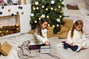 Two little girls in Christmas background photo
