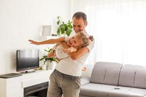 Happy loving family. Father and his daughter child girl playing together. Father's day concept photo