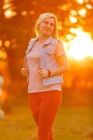 Cute lady walking through the meadow photo