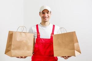 paper containers for takeaway food. Delivery man is carrying photo