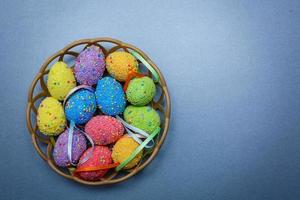 Easter eggs on a blue wooden table photo