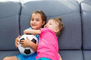 little girls with soccer ball at home photo