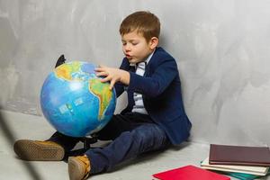 Schoolboy with globe photo