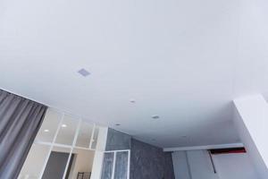 White ceiling with spot lights in room photo