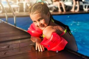 Children on water slide at aquapark. Summer holiday. photo