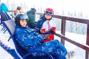 Group of friends with ski on winter holidays - Skiers having fun on the snow photo