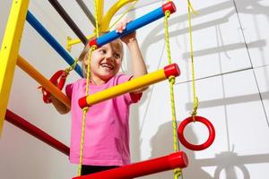 8 years old child playing on sports equipment photo