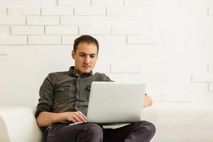 Businessman analyzing investment charts with laptop. Accounting photo