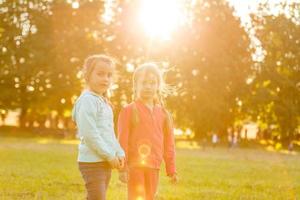 two little friends girls in the field. photo