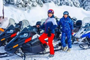 Winter Motorcycle. Snowmobile. Winter ATVs. Winter ATVs in winter against the backdrop of the mountain. photo