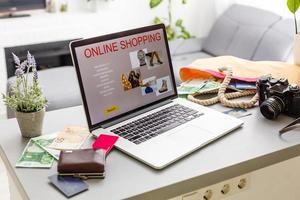 Online shopping website on laptop screen photo