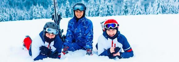 Group of friends with ski in the mountains photo