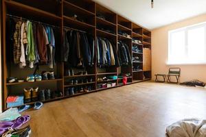 wardrobe with things in the old house, men's clothes. Interior. photo