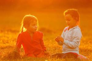 Beautiful little girls enjoying outside photo