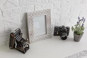 blank photo frame with film camera