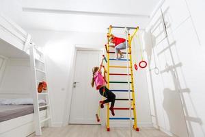 Two cute little girls playing role game in daycare photo