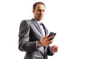 Happy businessman talking on the phone with folder in hand isolated over white background in studio shooting photo
